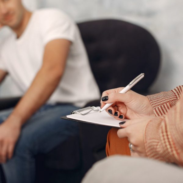 man-sitting-psychologist-s-office-talking-about-problems-1-1024x683